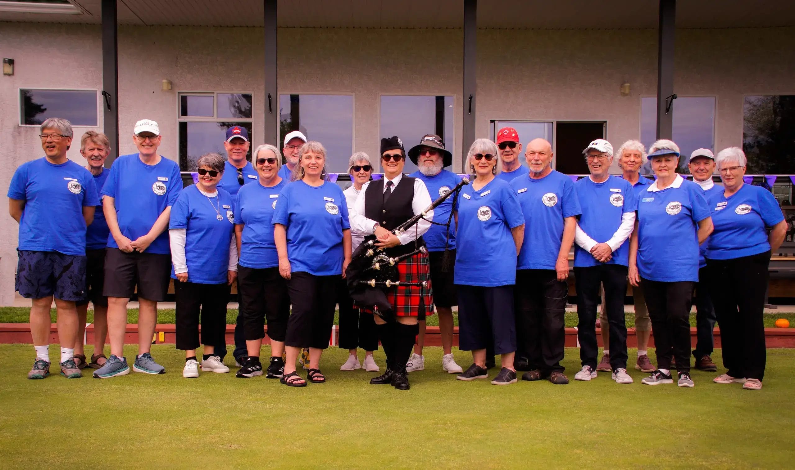 Courtnenay Lawn Bowling Club group photo with piper